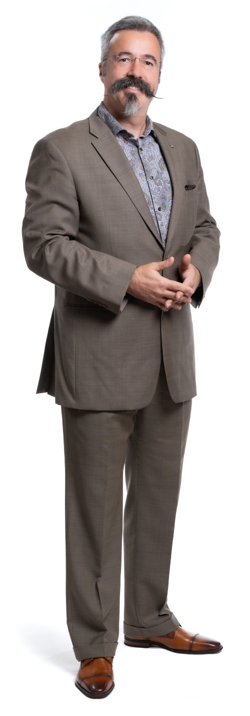 Photograph of Dr. Thomas J. Tobin in a suit: a white man with gray hair, glasses, and a large black mustache.